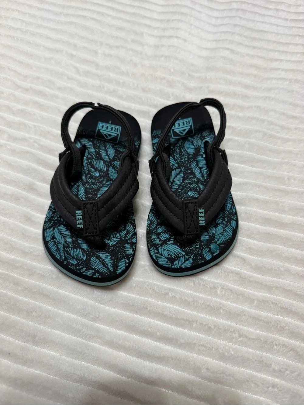Reef Kids Black and Teal Leaf-Print Flip Flops
